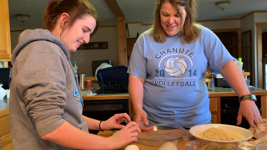 Sophomore Angel Keidel and CTE Teacher Sherri Bagshaw have fun while they cook some chicken fried steak.