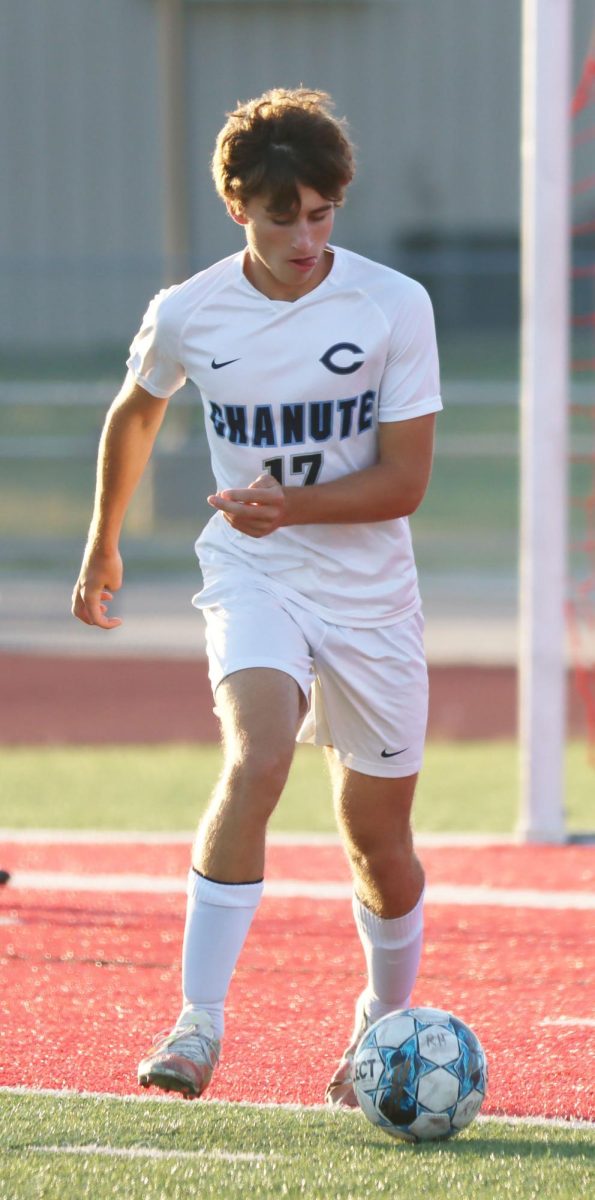 Senior Mike Stanley dribbles up field.